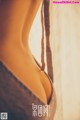A close up of a woman's butt in a bra.